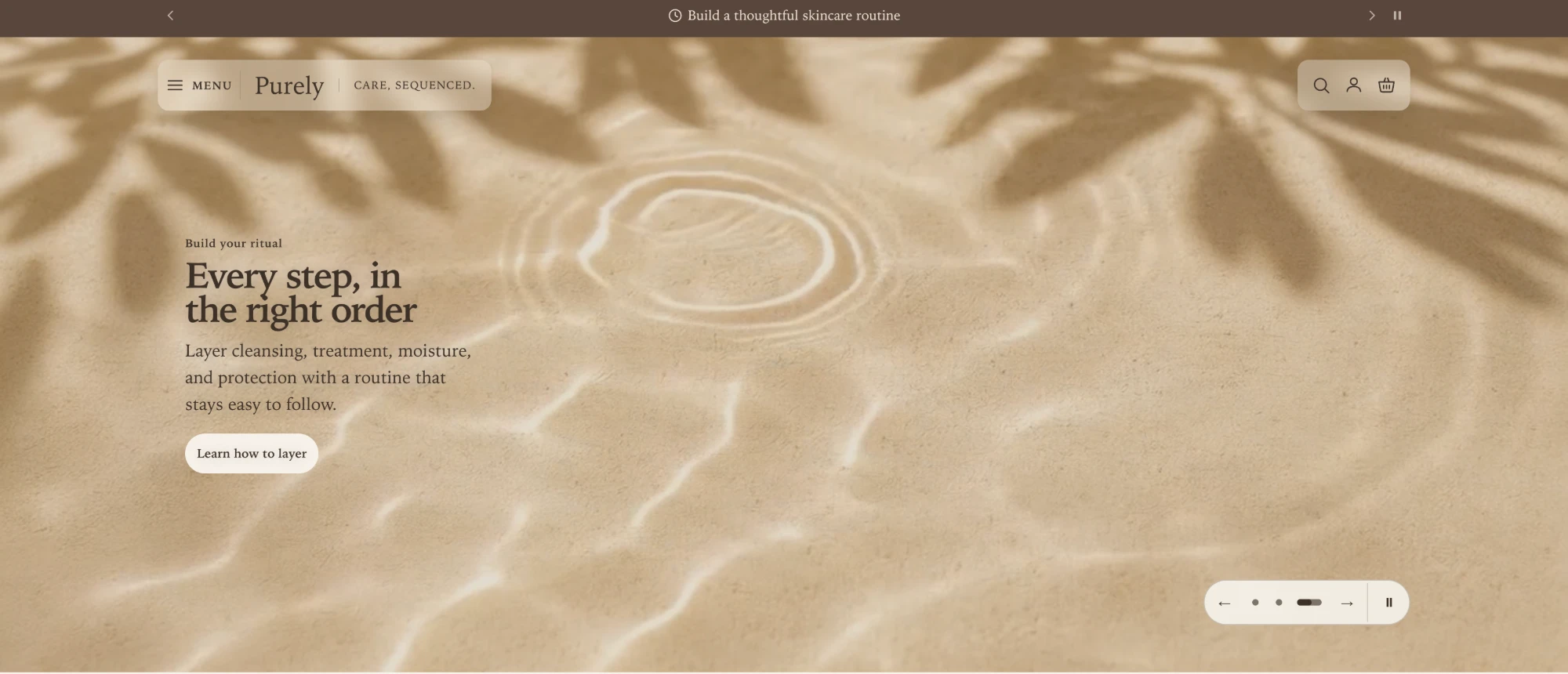 Full canvas hero scene with no text surface, dark text set directly on a sand-colored background video